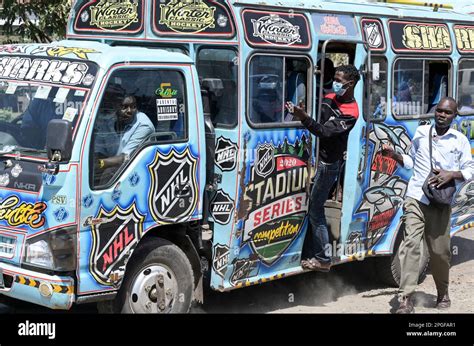 KENYA, Nairobi, Graffiti street art and traffic, colorful painted SACCO mini bus Matatu / KENIA ...