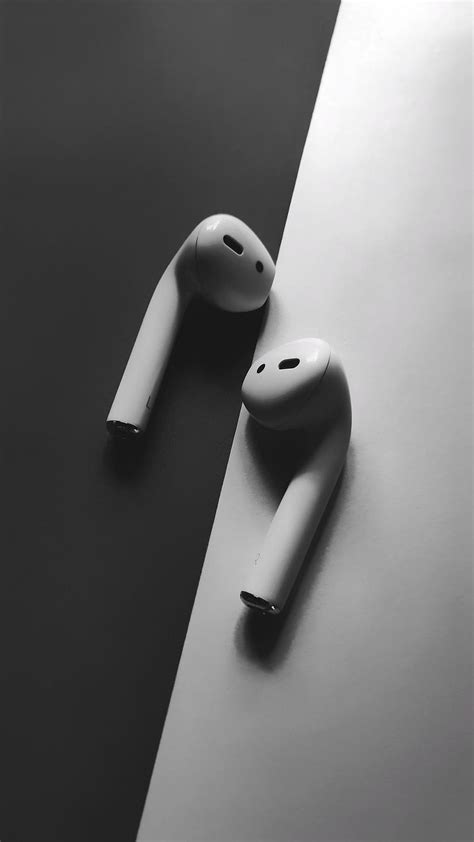 White Apple airpods, headphones in black and white background. ph… in ...