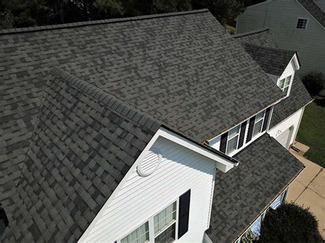 an aerial view of a house with gray shingles