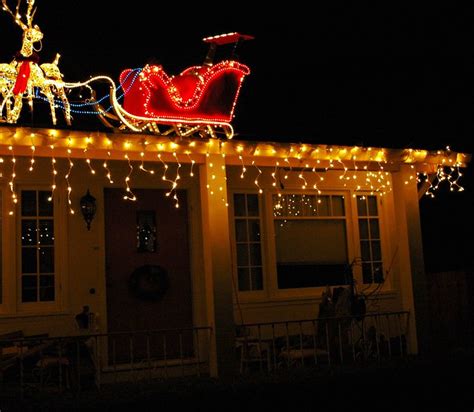 Where's Santa? wonders a tiny reindeer, up on the rooftop gazing at the ...