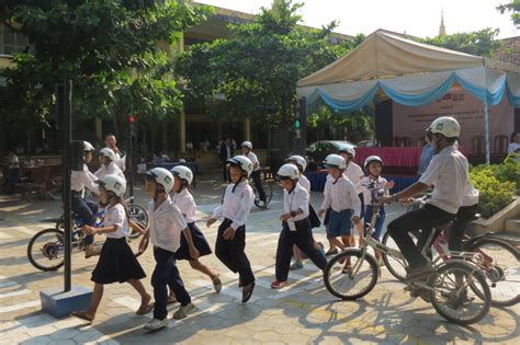 Students receive new helmets and road safety education supporting UN ...