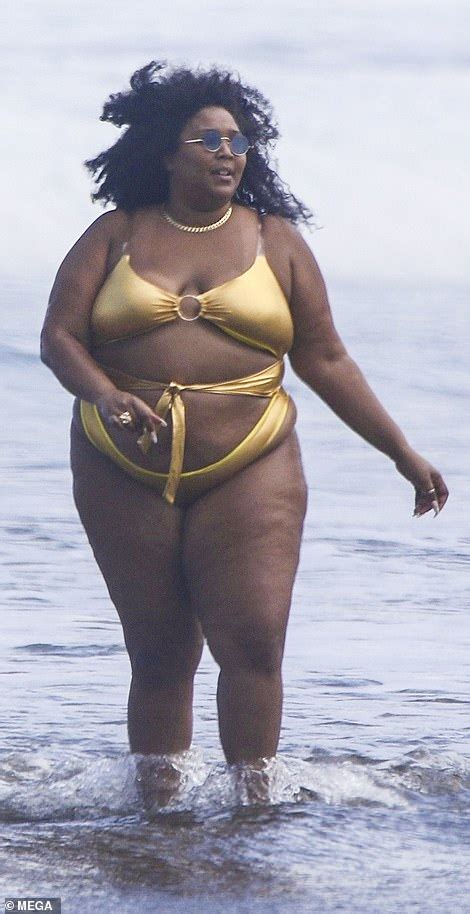 Lizzo flies the flag for body positivity as she hits the beach in gold ...