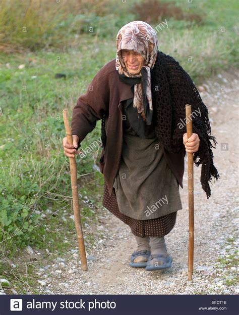 Old lady walking with two sticks Stock Photo, Royalty Free Image ...