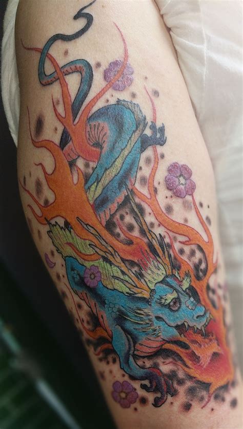 Blue green fiery dragon tattoo | Dragon tattoo, Tattoos, Fiery dragon