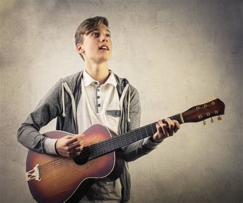 Boy with guitar stock image. Image of instrumental, guitar - 71278857