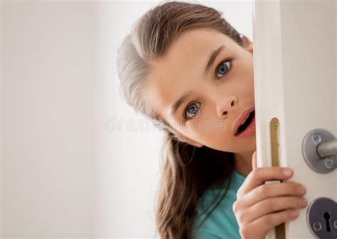 Scared Beautiful Girl Hiding Behind Door at Home Stock Photo - Image of face, junior: 85915008