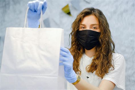 Woman With Face Mask and Latex Gloves Holding a Shopping Bag · Free ...