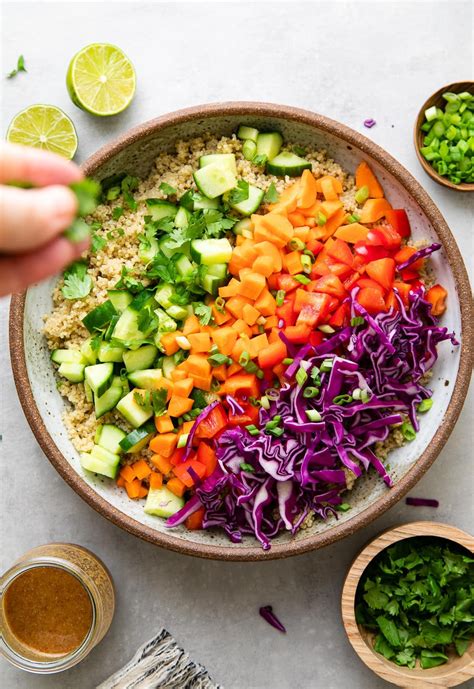 Crunchy Thai Quinoa Salad recipe features a colorful mix of veggies and tossed with a quick ...