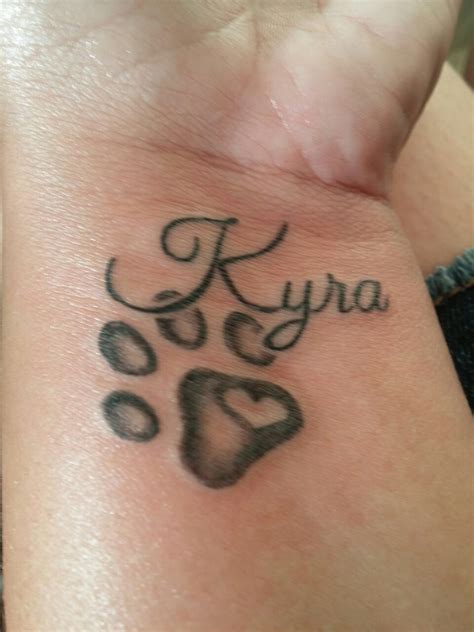 "Kyra" for always in my and on my wrisk "tattoo" | Tattoos, Tattoo designs, Dog paw tattoo