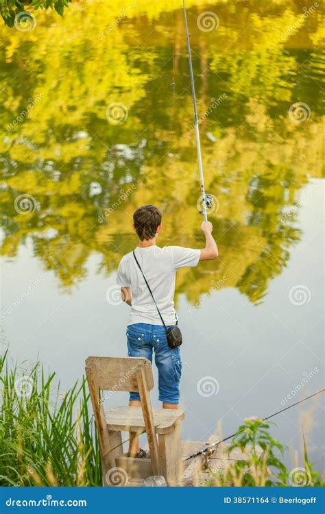 Young boy fishing stock photo. Image of activity, golden - 38571164