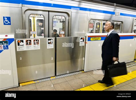 Subway station platform at Suidobashi, Tokyo, Japan, has safety gates ...