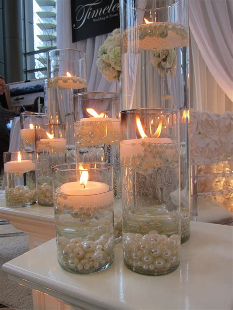 candles with pearls | Wedding table centerpieces, Wedding centerpieces, Water wedding centerpieces