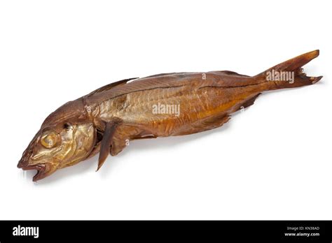 Smoked haddock fish on white background Stock Photo - Alamy