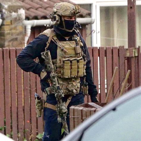 British Special Air Service (SAS) trooper armed with a L119A2 carbine during the Newcastle ...