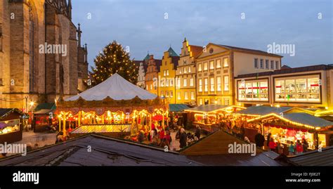 Germany, Osnabrueck, Christmas market on market place, gable houses in the evening Stock Photo ...