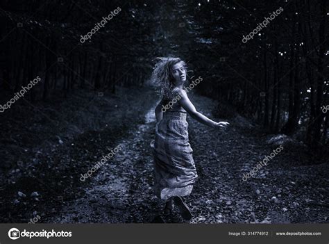 Scared Woman Running Forest Stock Photo by ©Xalanx 314774912