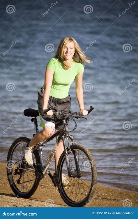 Woman riding bike on beach stock image. Image of ocean - 11518147