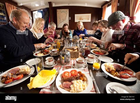 A group of people eating a fried full english breakfast, Suffolk UK Stock Photo - Alamy