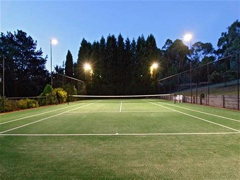 Garden tennis court at night