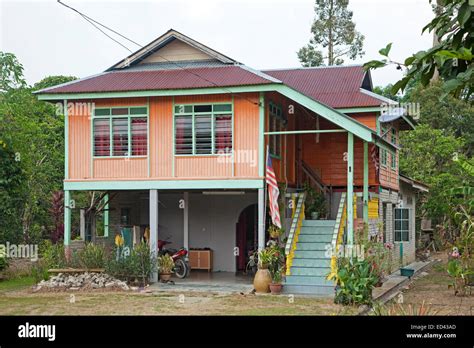 Modern Malaysian wooden house on pillars in the countryside near ...