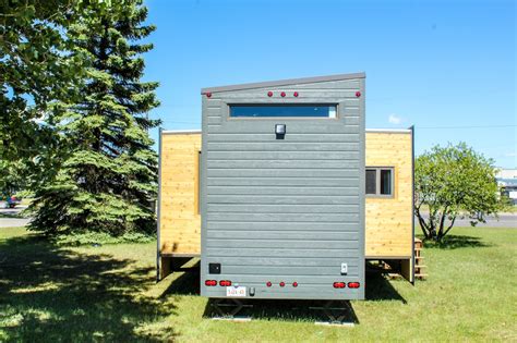 Expanding Tiny House on Wheels with Huge Slide Outs: Expands with the Touch of a Button!