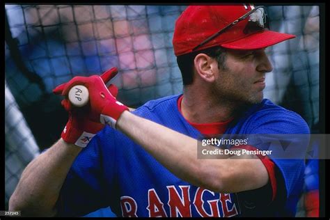 Infielder Bill Ripken of the Texas Rangers stands in the batters box ...