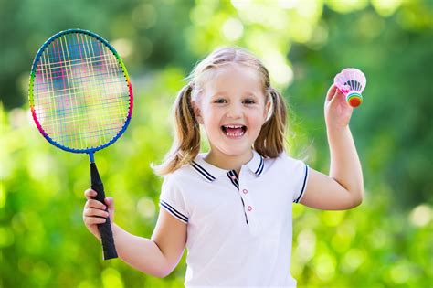 Child Playing Badminton Or Tennis Outdoor In Summer - Careers in Sport