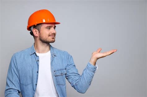 Premium Photo | Young man civil engineer in safety hat