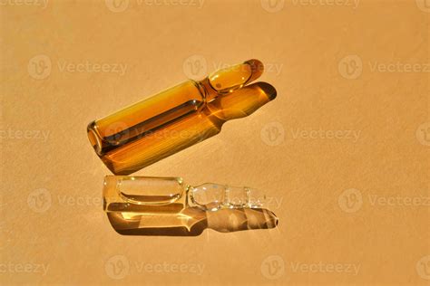 Glass ampoules on a beige orange background. 32515299 Stock Photo at Vecteezy