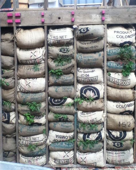 Vertical garden from upcycled coffee bags and scaffolding boards. Skip Garden, London N1 ...