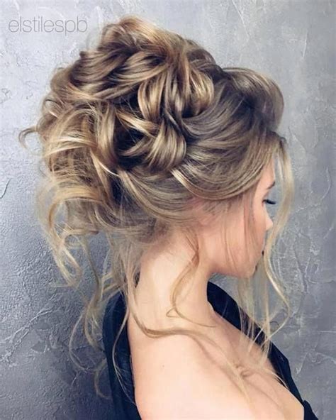 Looped updo with tendrils #avedaibw #uniqueweddinghairstyle | Messy ...