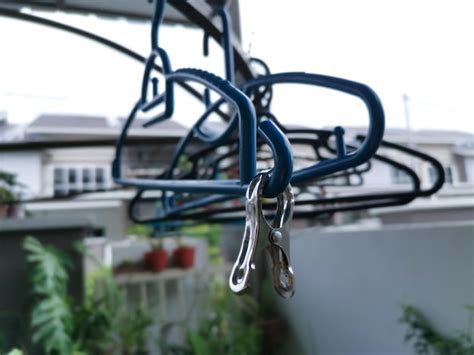 Premium Photo | Metallic or plastic hangers and clips use to dry clothes outdoor at the open ...