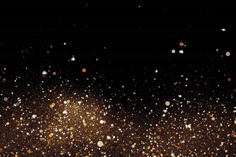 Download Black Surface With Gold Glitter Wallpaper | Wallpapers.com