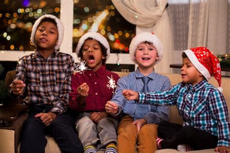 Premium Photo | Kids singing christmas song. four children sing christmas song. shall we sing ...