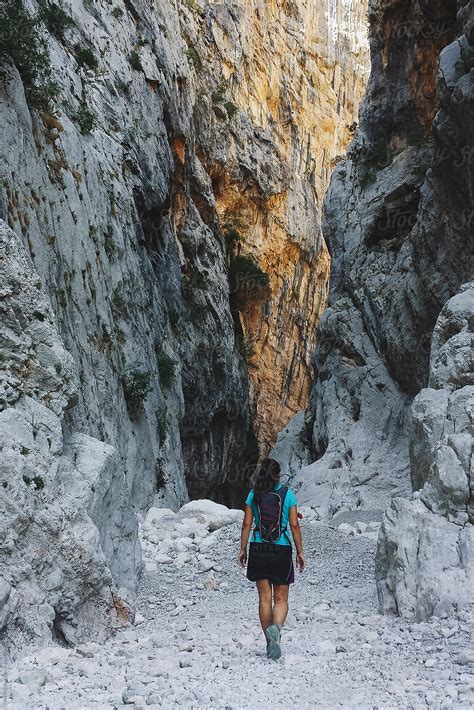 "Tanned Woman Hiking At Su Gorroppu Canyon , Sardinia, Italy" by Stocksy Contributor "Sky-Blue ...