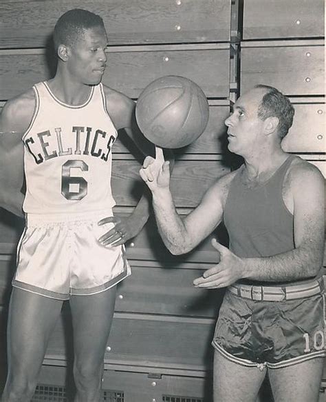 Red Auerbach Shows Rookie Bill Russell HOw To Spin A Ball