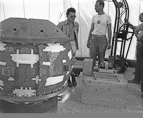 Manhattan Project scientists standing next to the first successfully ...