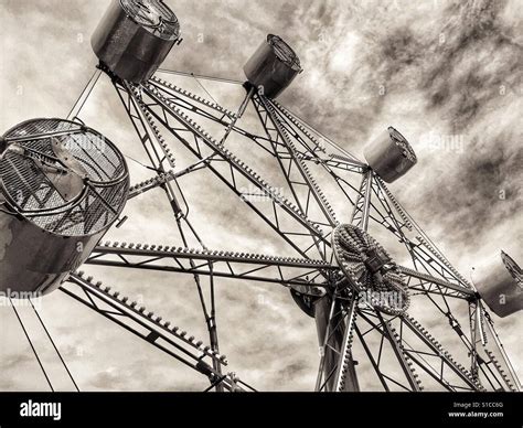 Sepia carnival ride against clouds hi-res stock photography and images ...