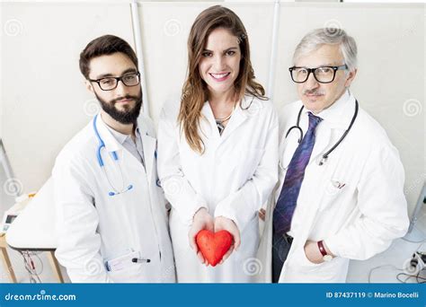 Group of Doctors with a Symbol Heart Stock Image - Image of girl, heart: 87437119