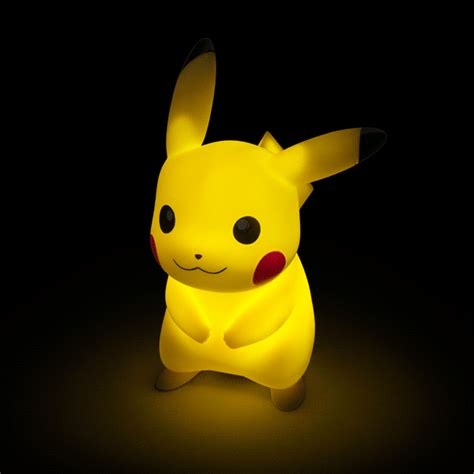 a pikachu lamp sitting in the dark