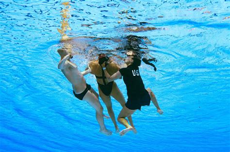 See Coach Rescue Swimmer After She Faints in Pool at Championships