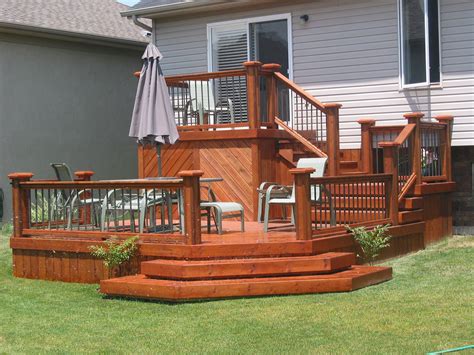 I like these tiered steps as an idea for the front deck | Decks backyard, Building a deck ...