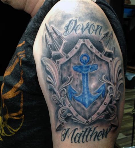 Family Crest Arm Tattoo by Mike Harmon : TattooNOW