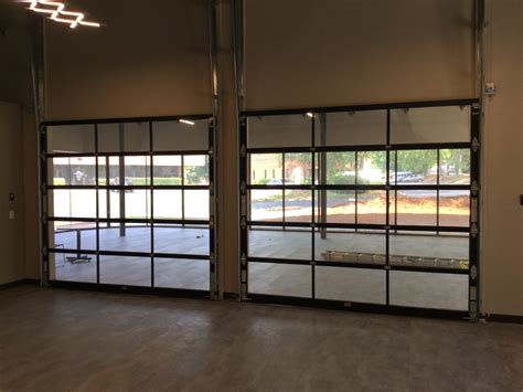 Glass Overhead Doors Installed In Office Norcross GA | Frosted Glass Modern Office | Commercial ...