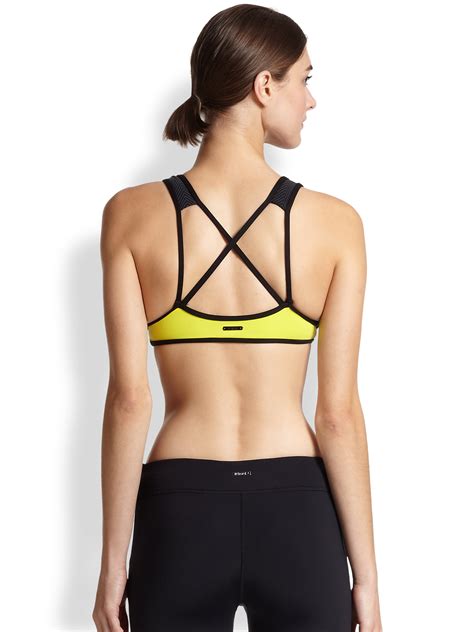 Koral activewear Criss Cross-Back Sports Bra in Yellow | Lyst