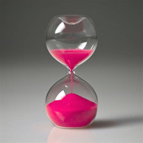 Hourglass with pink sand on neutral background. | Pink camera, Everything pink, Pink and grey room