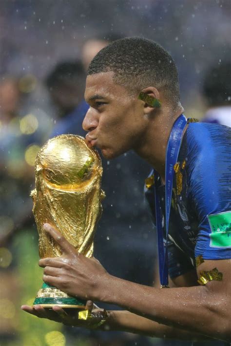 MOSCOW, RUSSIA - JULY 15: Kyliane Mbappe of France celebrates with the World Cup Trophy ...