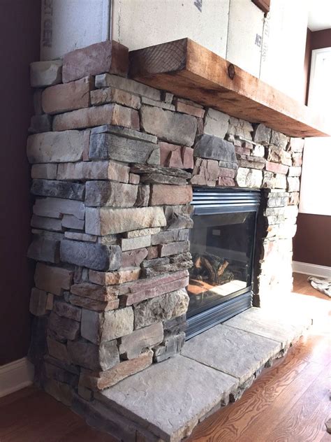 A step-by-step DIY stone veneer installation on a fireplace. In only 4 ...