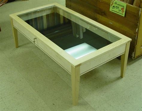This is a shadow box coffee table. I love this for a living room or family room, game room whate ...