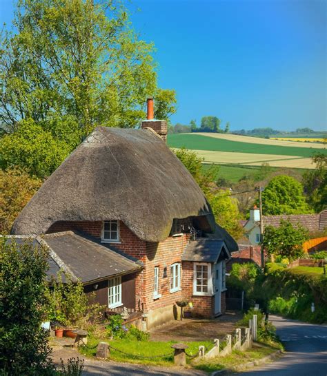 A pretty thatched cottage above the village of Pitton in Wiltshire. Credit Anguskirk | Thatched ...